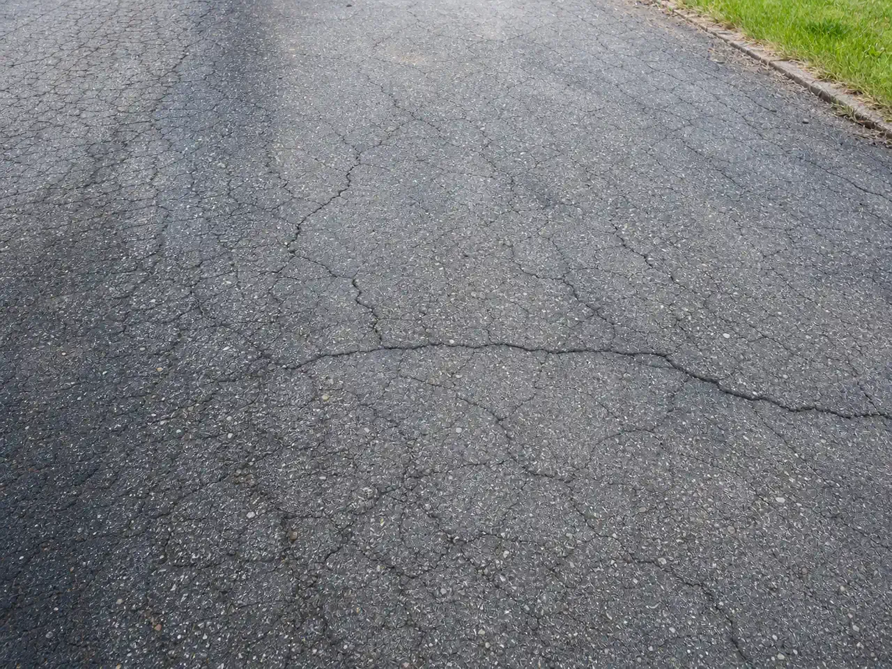 Sealcoat vs Resurface vs Replace: The Driveway Decision Rule